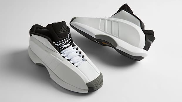 Side view of Kobe Bryant's white and black adidas shoes.